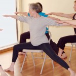 Image of Woman Doing Warrior 2 Pose on a Chair