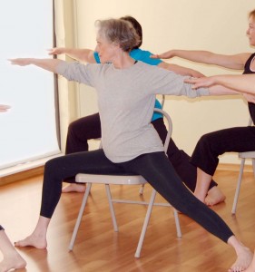 Image of Woman Doing Warrior 2 Pose on a Chair